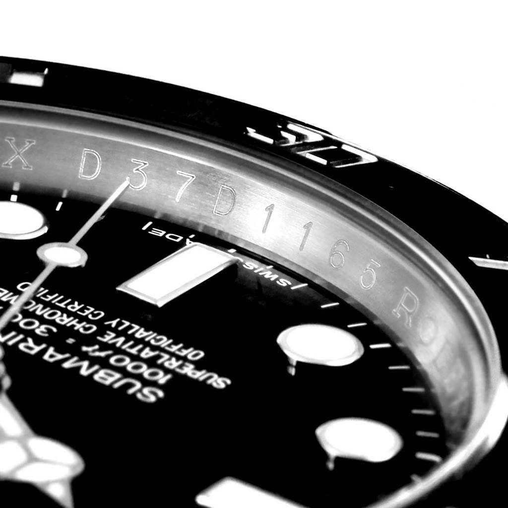 The image shows a close-up of the dial, bezel, and part of the markings of the Rolex Submariner 114060 Men's Stainless Steel Black Dial 114060 Men's Stainless Steel Black Dial watch.
