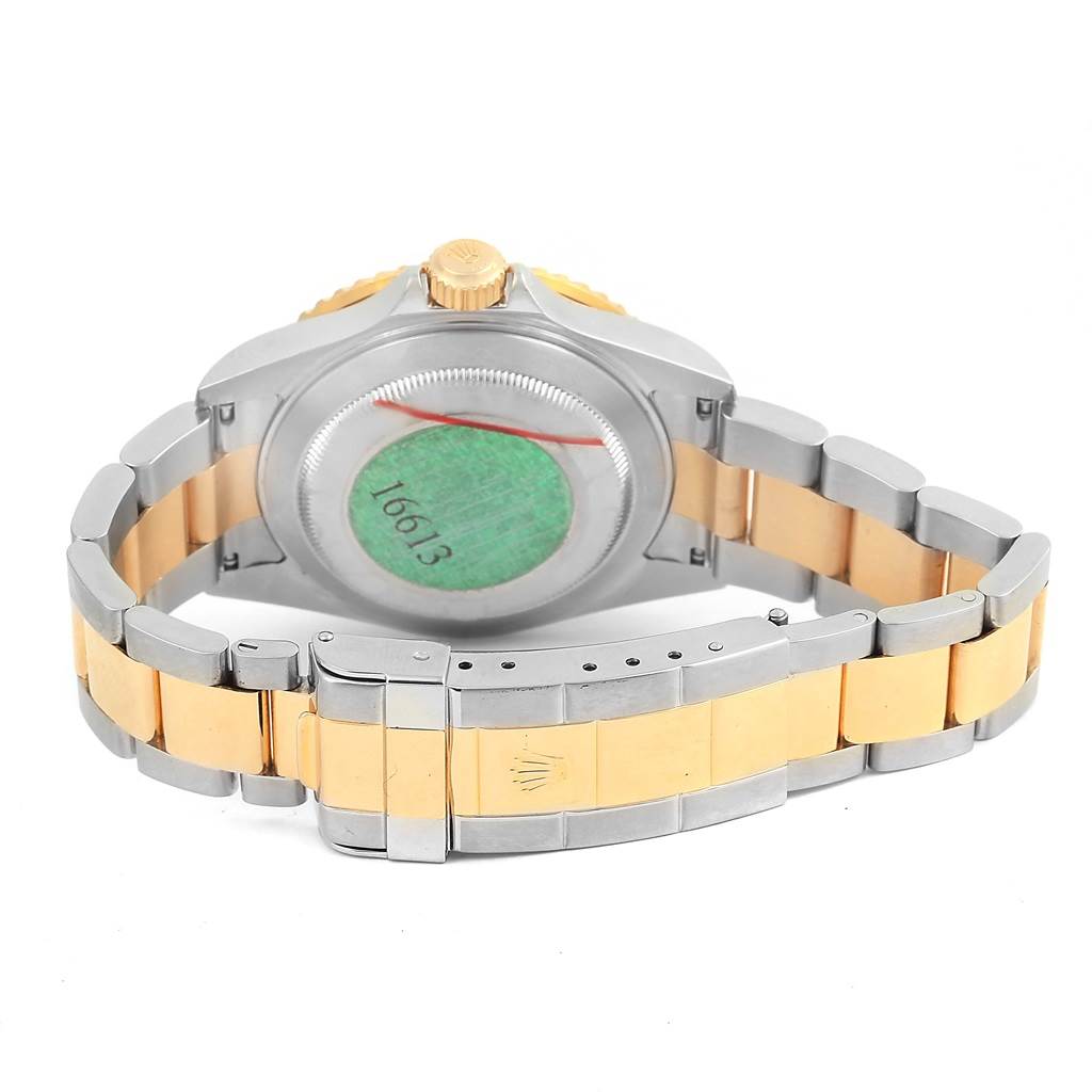 The image shows the back and clasp of a Rolex Submariner 16613 Men
s Steel and Gold (two tone) Grey Dial 16613 Men
s Steel and Gold (two tone) Grey Dial watch.
