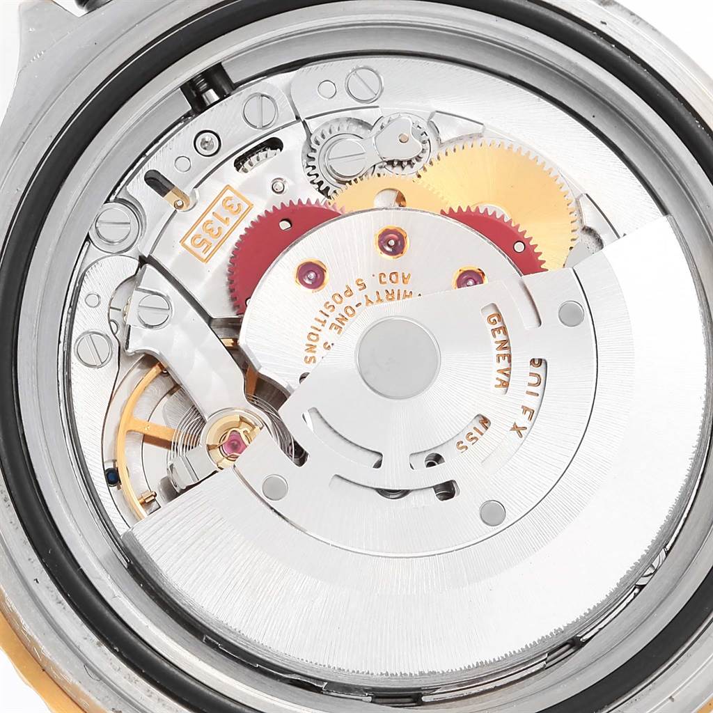 This image shows the internal mechanism and movement of the Rolex Submariner 16613 Men
s Steel and Gold (two tone) Grey Dial 16613 Men
s Steel and Gold (two tone) Grey Dial watch from a close-up rear angle.