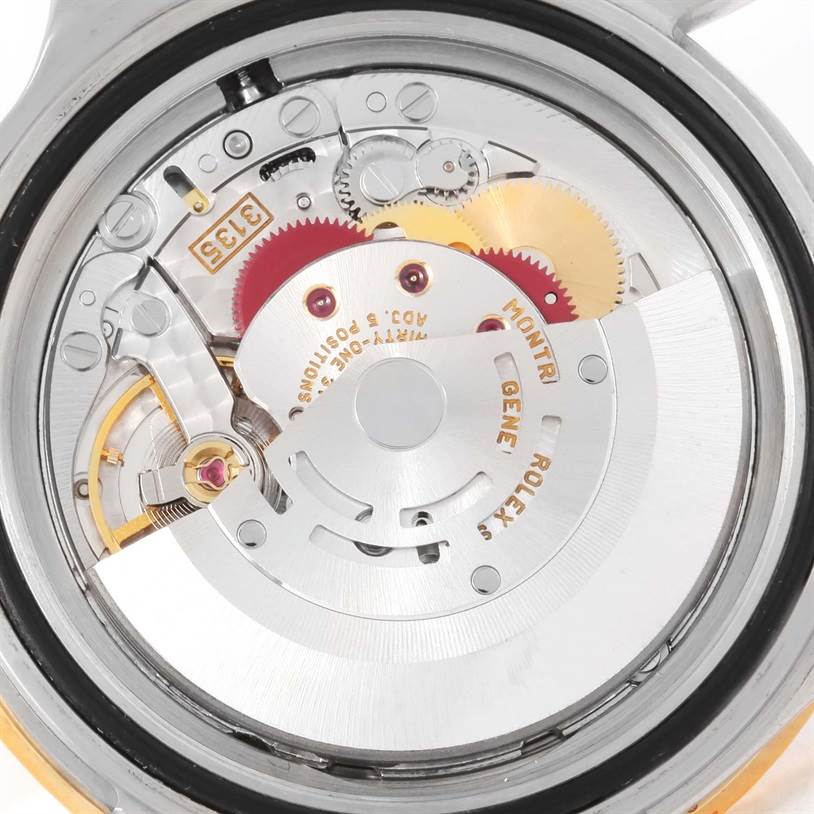 The image shows the inner mechanical movement of a Rolex Submariner 16613 Men's Steel and Gold (two tone) Champagne Dial 16613 Men's Steel and Gold (two tone) Champagne Dial watch, focusing on the rotor and gears.