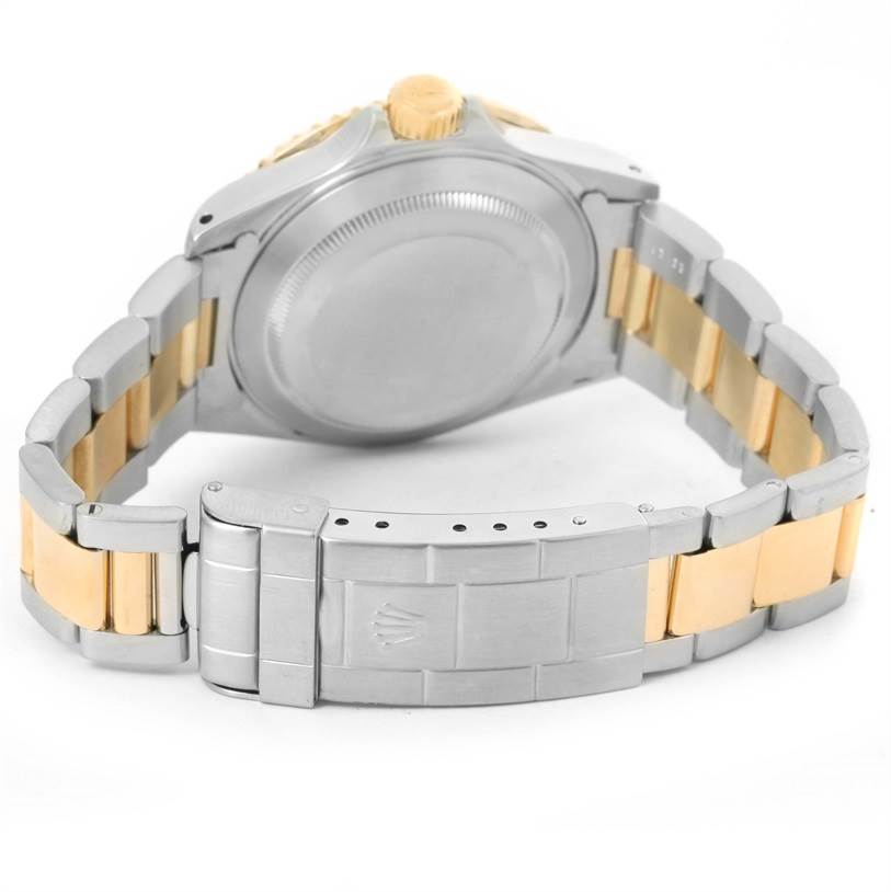 This image shows the back case and metal bracelet clasp of a Rolex Submariner 16613 Men's Steel and Gold (two tone) Champagne Dial 16613 Men's Steel and Gold (two tone) Champagne Dial watch at a rear angle.