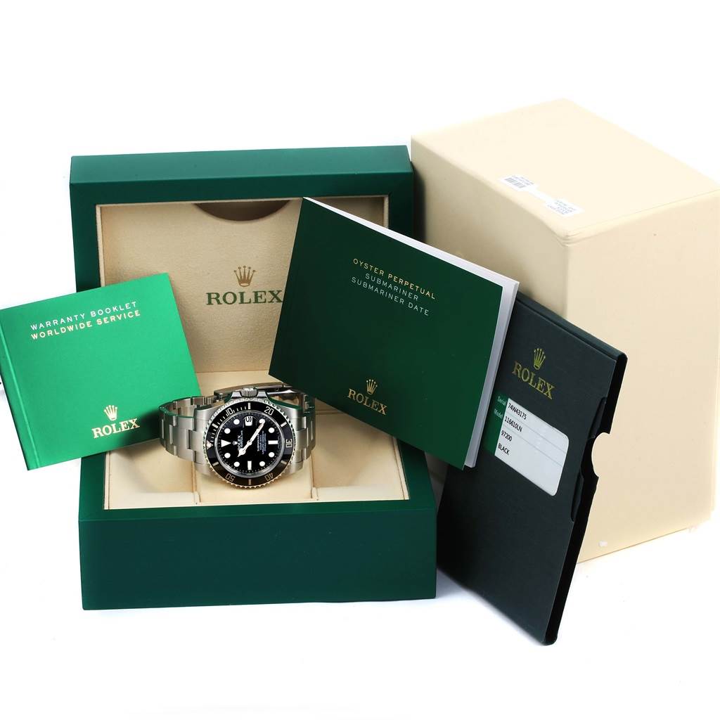 The image shows a Rolex Submariner 116610 Men's Stainless Steel Black Dial 116610 Men's Stainless Steel Black Dial watch with its packaging, warranty booklet, and manual, presented at a front angle.