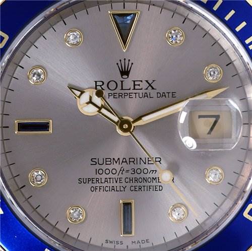 Close-up of the Rolex Submariner 16613 Men's Stainless Steel Grey Dial 16613 Men's Stainless Steel Grey Dial watch face, showing hour markers, hands, date window, and text details.