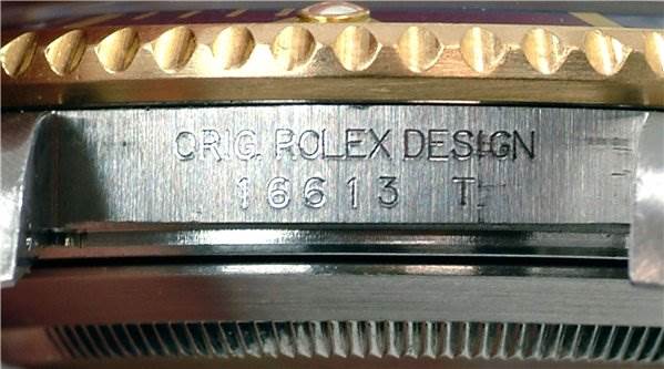 Close-up of the Rolex Submariner 16613 Men's Stainless Steel Grey Dial 16613 Men's Stainless Steel Grey Dial model showing the side engraving with model number and "Orig Rolex Design."