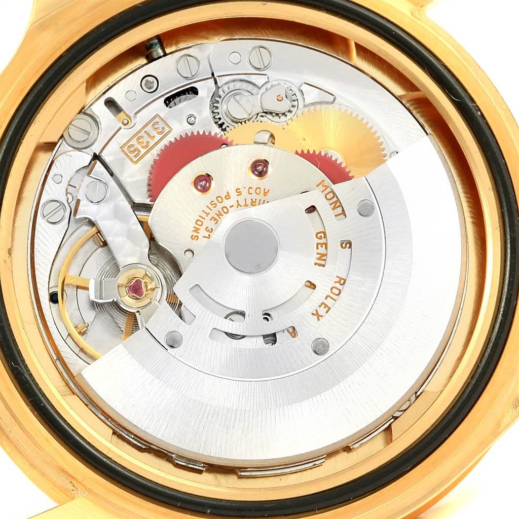 The image shows the internal mechanism of a Rolex Submariner 16618 Men's Yellow Gold Blue Dial 16618 Men's Yellow Gold Blue Dial watch viewed from the back.