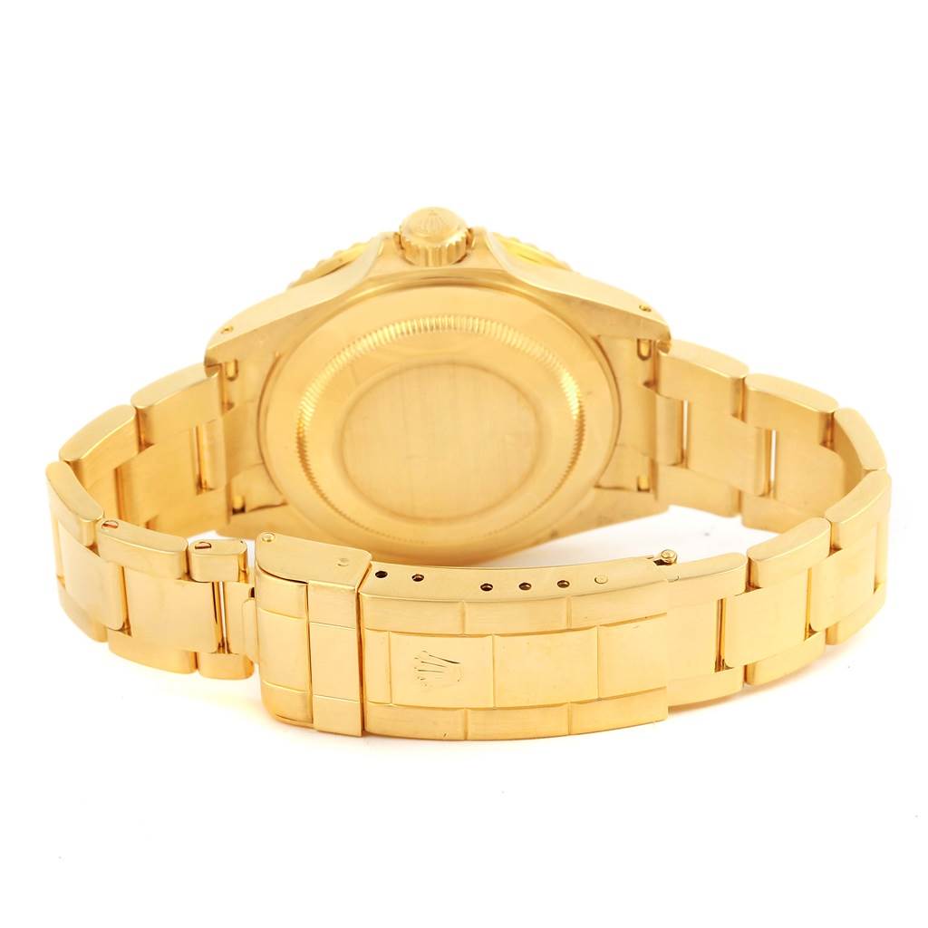 The image shows the case back, crown, and bracelet of a gold Rolex Submariner 16618 Men's Yellow Gold Blue Dial 16618 Men's Yellow Gold Blue Dial watch from a rear angle.