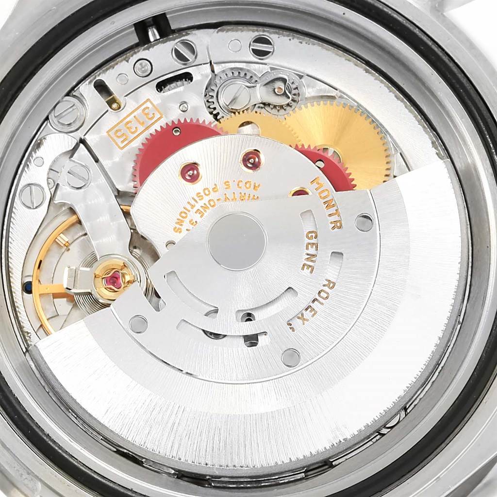 This image shows the intricate internal movements and gears of a Rolex Submariner 16610LV Men's Stainless Steel Black Dial 16610LV Men's Stainless Steel Black Dial watch viewed from the back.