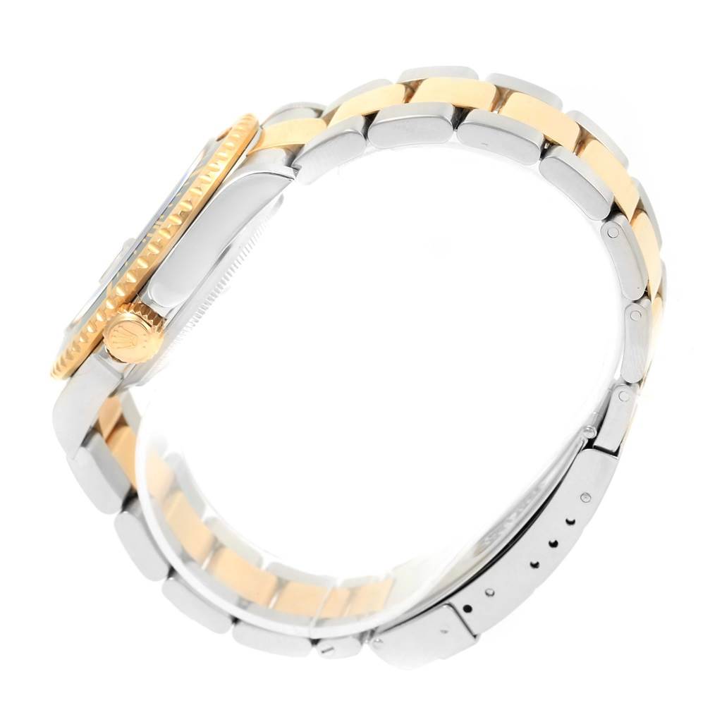 The image shows a side view of a Rolex Submariner 16613 Men's Stainless Steel Black Dial 16613 Men's Stainless Steel Black Dial watch, highlighting its two-tone bracelet, crown, and case edge.