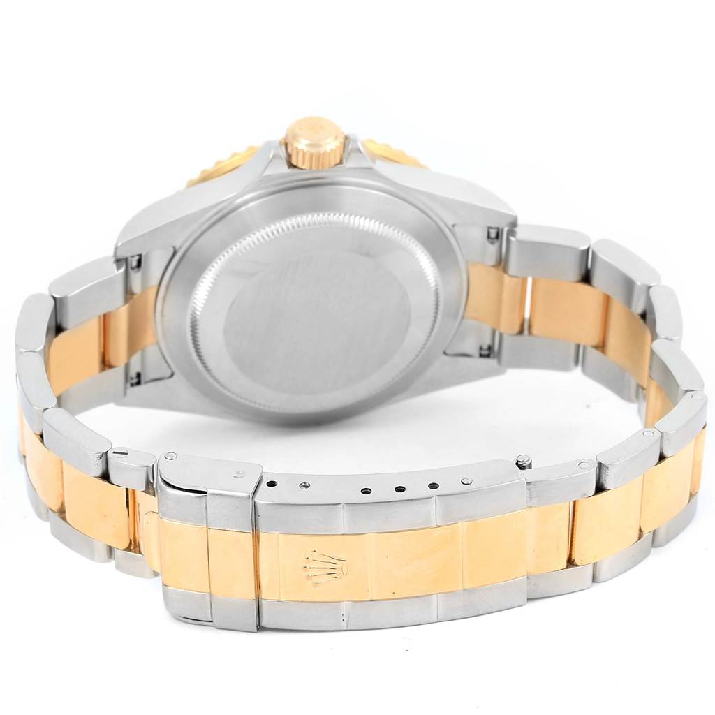 The image shows the back and clasp of a Rolex Submariner 16613 Men's Stainless Steel Black Dial 16613 Men's Stainless Steel Black Dial watch, highlighting its metal bracelet and two-tone design.