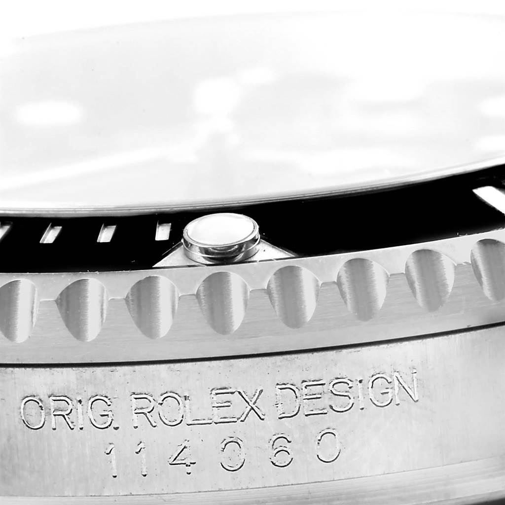 The image shows a close-up of the side of the bezel and case of a Rolex Submariner 114060 Men's Stainless Steel Black Dial 114060 Men's Stainless Steel Black Dial watch, highlighting the model number.