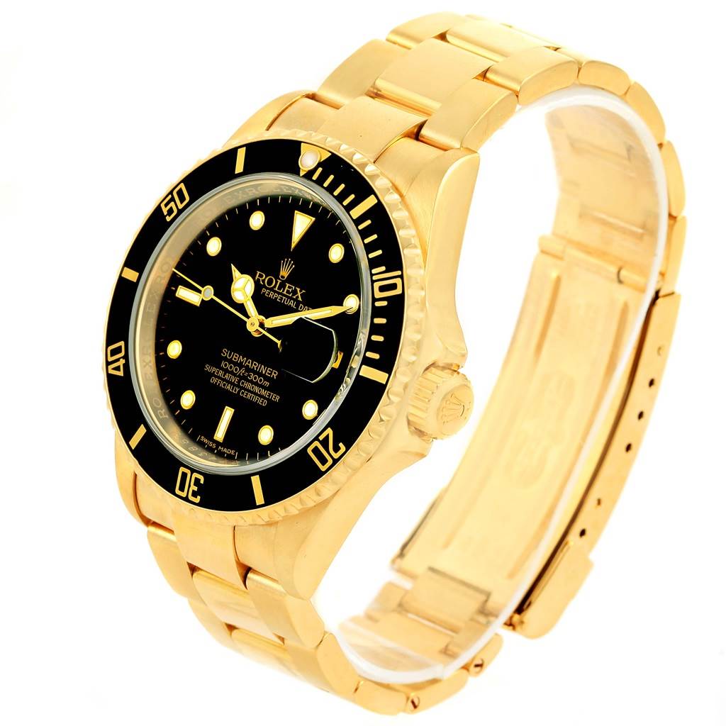 This image shows a Rolex Submariner 16618 Men's Yellow Gold Black Dial 16618 Men's Yellow Gold Black Dial watch at a slight angle, highlighting its black dial, gold bracelet, and bezel.