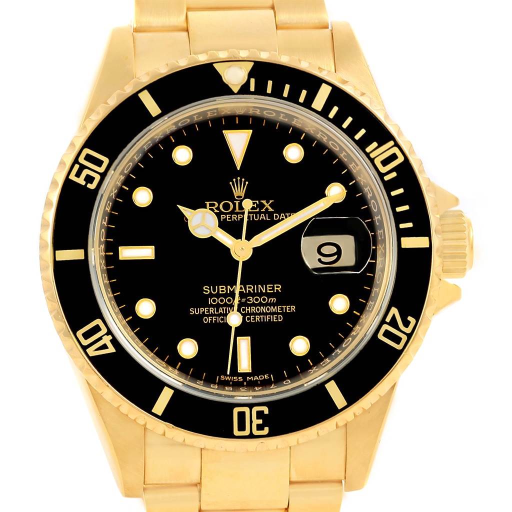 The image shows a front view of a Rolex Submariner 16618 Men's Yellow Gold Black Dial 16618 Men's Yellow Gold Black Dial watch with a black dial and gold bracelet.