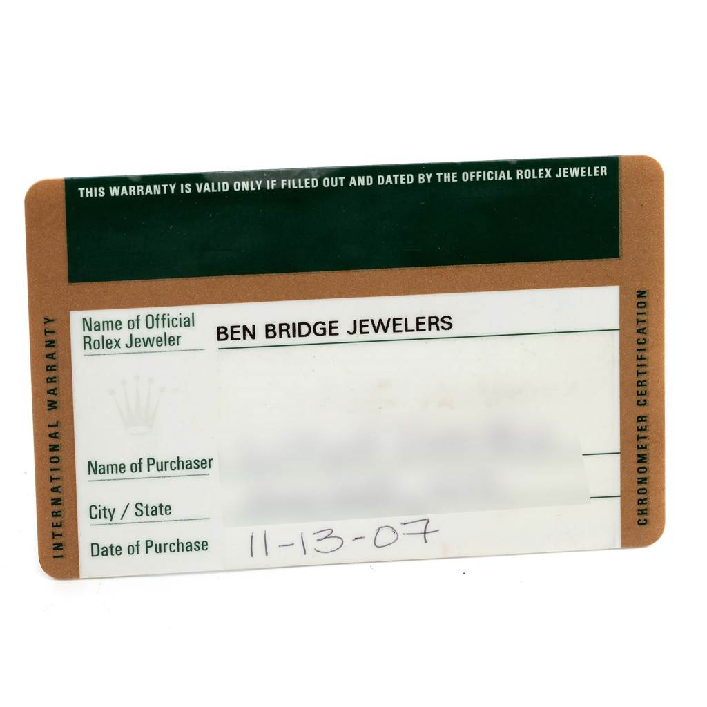 This image shows the warranty card of a Rolex Submariner 16613 Men's Steel and Gold (two tone) Blue Dial 16613 Men's Steel and Gold (two tone) Blue Dial watch, specifying the official Rolex jeweler and purchase date.