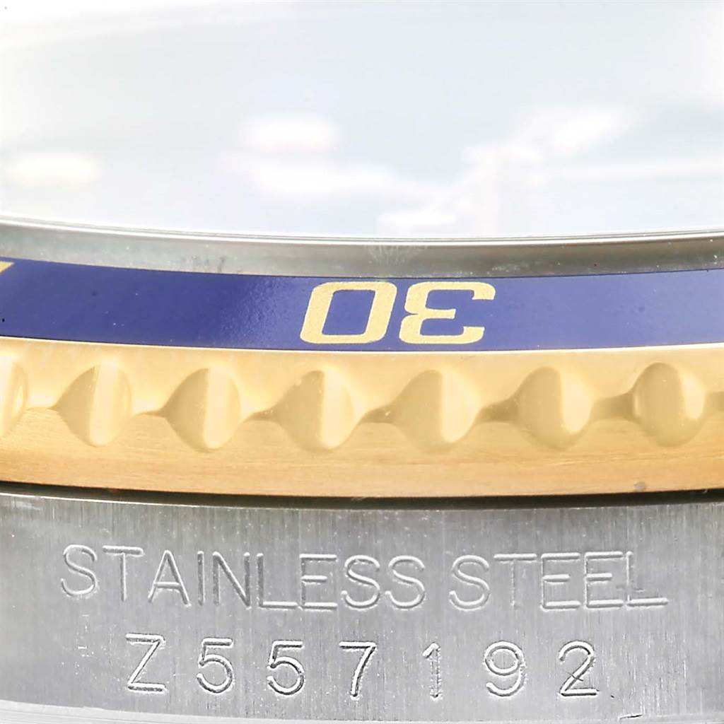 Close-up of the Rolex Submariner 16613 Men's Steel and Gold (two tone) Blue Dial 16613 Men's Steel and Gold (two tone) Blue Dial showing the stainless steel case, part of the bezel, and the 30-minute mark on the bezel.