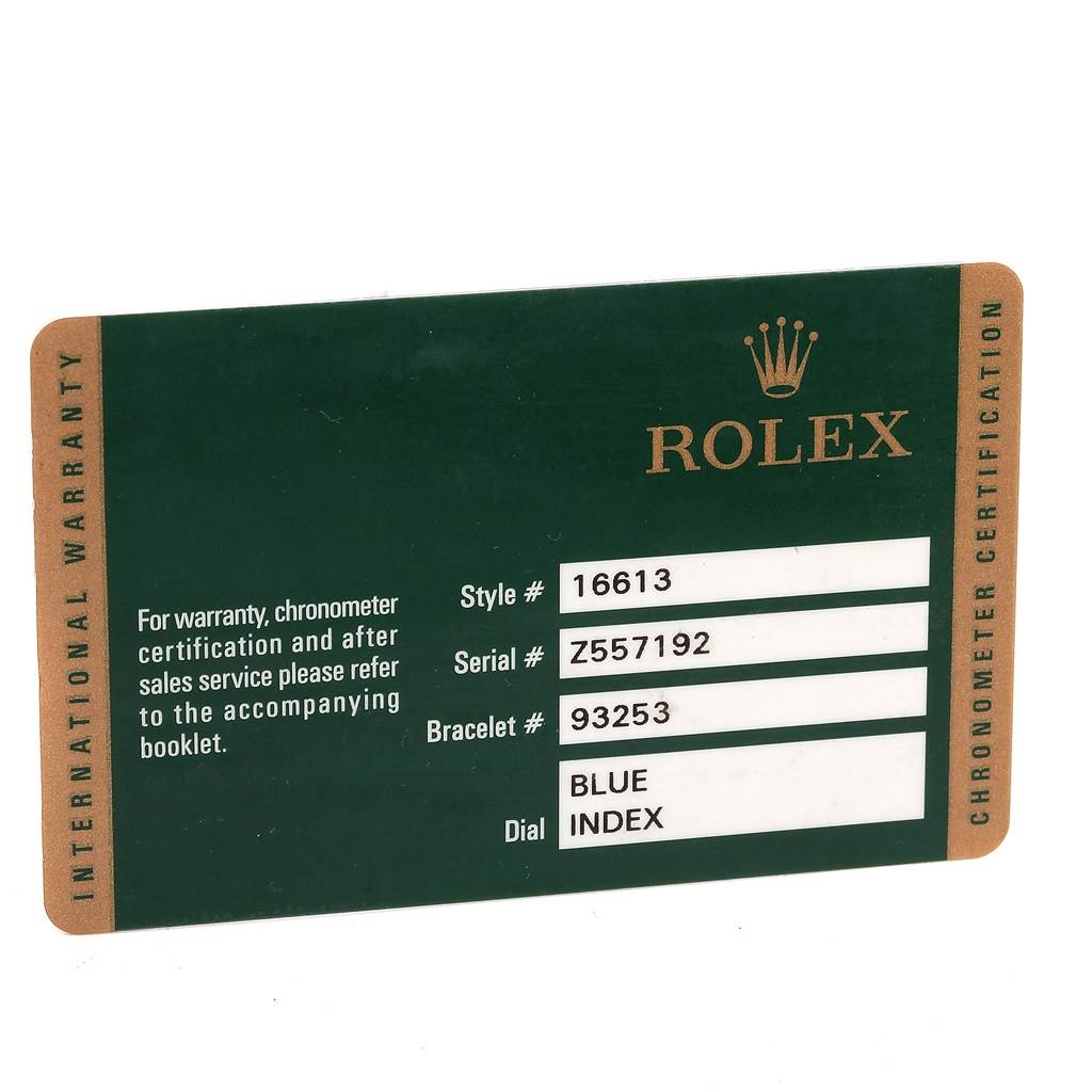 The image shows an International Warranty card for the Rolex Submariner 16613 Men's Steel and Gold (two tone) Blue Dial 16613 Men's Steel and Gold (two tone) Blue Dial model, detailing style, serial, bracelet, and dial information.