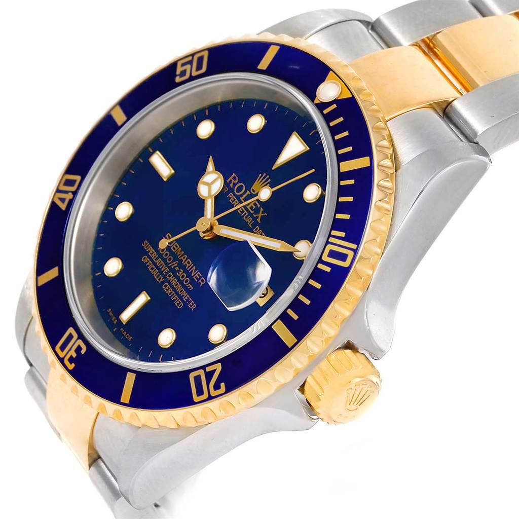 The image shows a close-up angle of the Rolex Submariner 16613 Men's Steel and Gold (two tone) Blue Dial 16613 Men's Steel and Gold (two tone) Blue Dial watch, highlighting its blue dial, bezel, and crown.