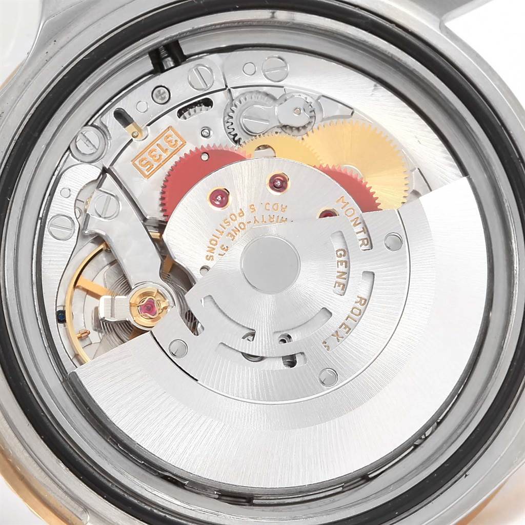 The image shows a close-up view of the movement and internal mechanisms of a Rolex Submariner 16613 Men
s Steel and Gold (two tone) Black Dial 16613 Men
s Steel and Gold (two tone) Black Dial watch.