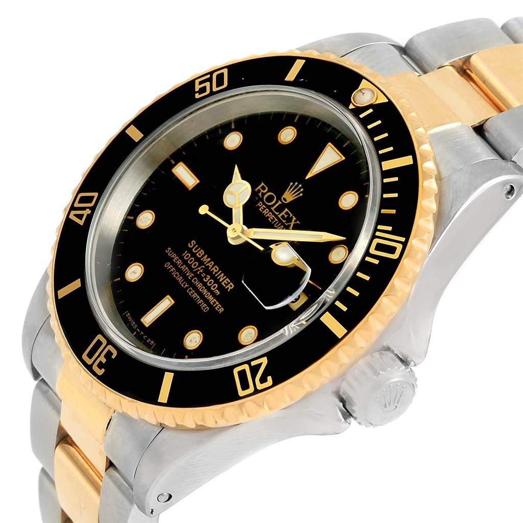 The image shows a side and angled view of the Rolex Submariner 16613 Men
s Steel and Gold (two tone) Black Dial 16613 Men
s Steel and Gold (two tone) Black Dial watch, focusing on the dial, bezel, crown, and part of the bracelet.