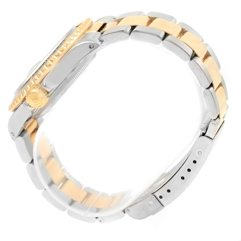 This image shows a side view of the Rolex Submariner 16613 Men
s Steel and Gold (two tone) Black Dial 16613 Men
s Steel and Gold (two tone) Black Dial watch, highlighting its two-tone bracelet and crown.