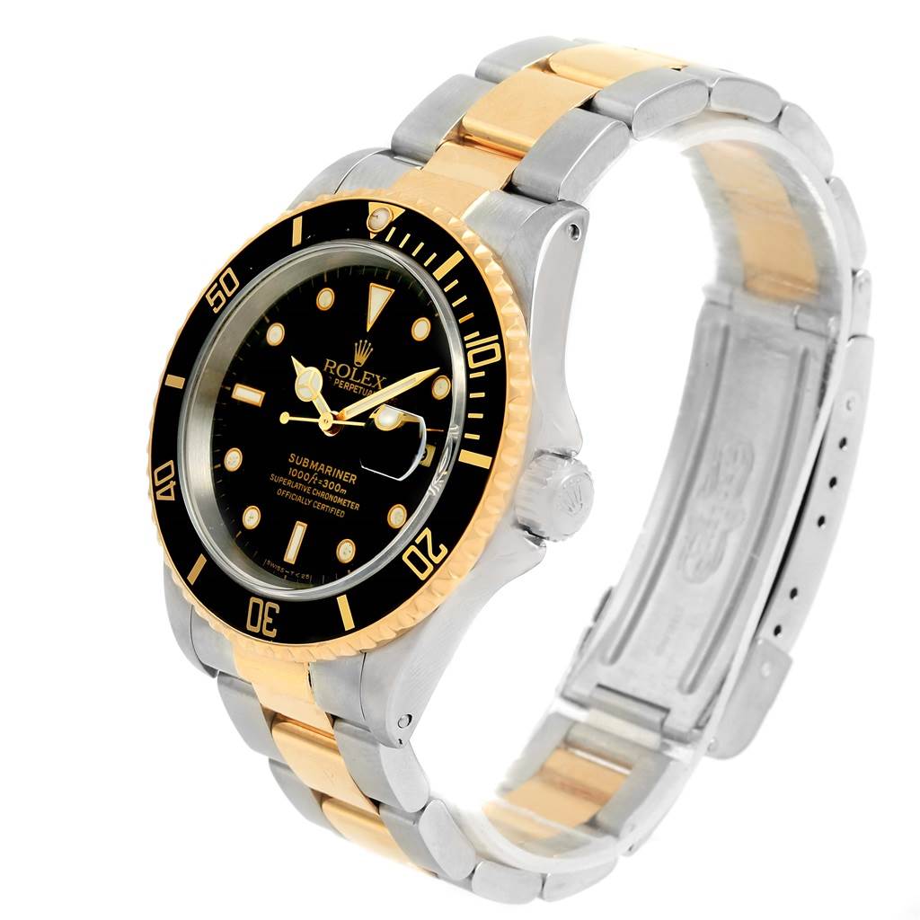 The Rolex Submariner 16613 Men
s Steel and Gold (two tone) Black Dial 16613 Men
s Steel and Gold (two tone) Black Dial watch is shown at an angle revealing the face, bezel, and two-tone metal bracelet.