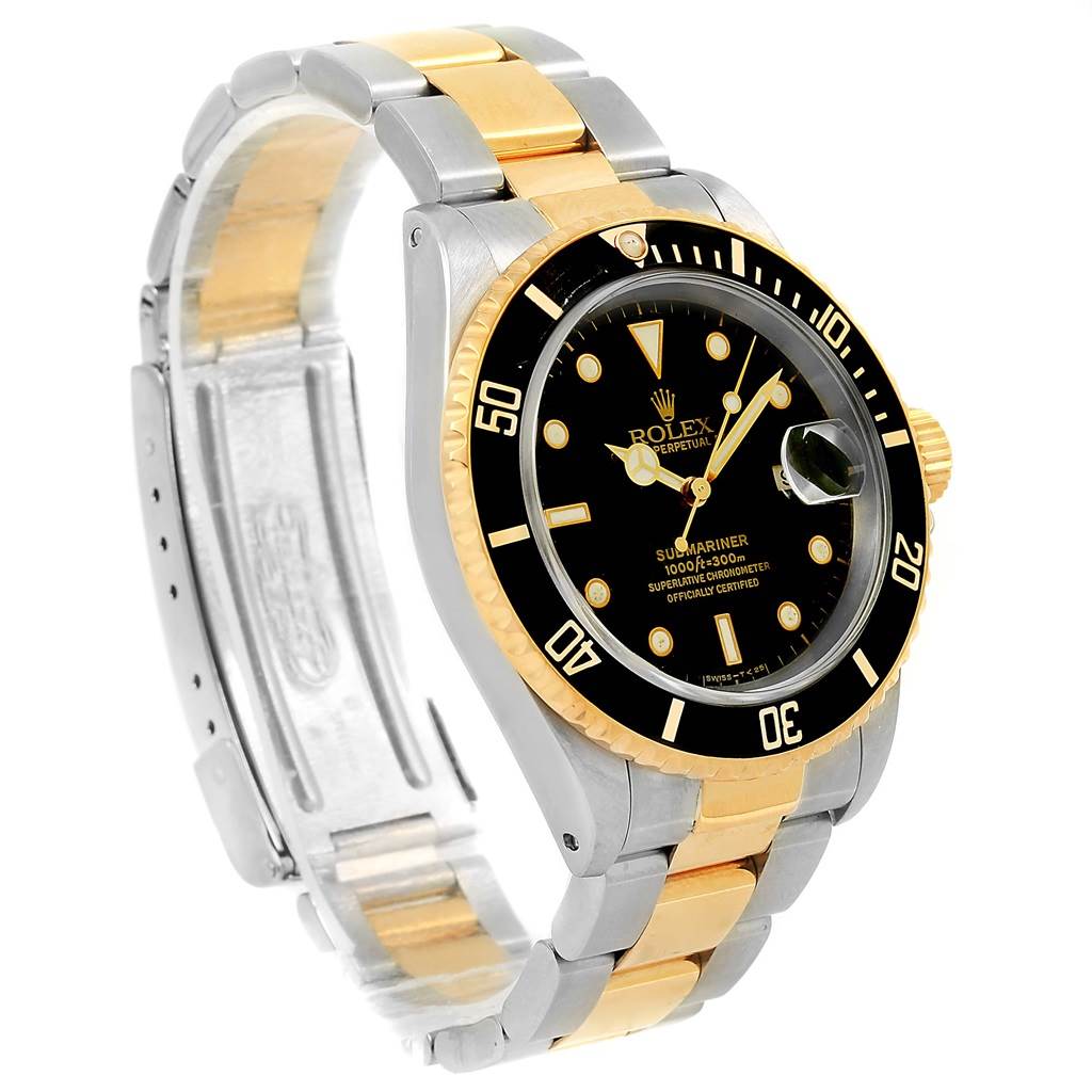The image shows a Rolex Submariner 16613 Men
s Steel and Gold (two tone) Black Dial 16613 Men
s Steel and Gold (two tone) Black Dial watch at a three-quarter angle highlighting its black dial, rotating bezel, and two-tone bracelet.