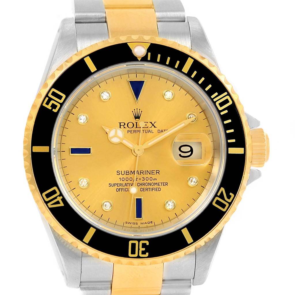 The Rolex Submariner 16613 Men's Steel and Gold (two tone) Champagne Dial 16613 Men's Steel and Gold (two tone) Champagne Dial watch is shown from the front, showcasing its yellow dial, date window, and two-tone bracelet.
