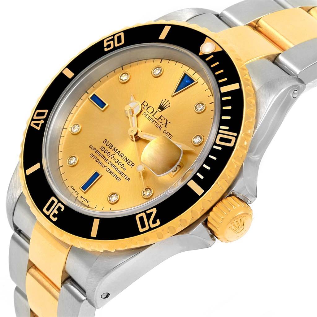 This image shows a close-up angle of a Rolex Submariner 16613 Men's Steel and Gold (two tone) Champagne Dial 16613 Men's Steel and Gold (two tone) Champagne Dial model, highlighting the dial, bezel, and bracelet.