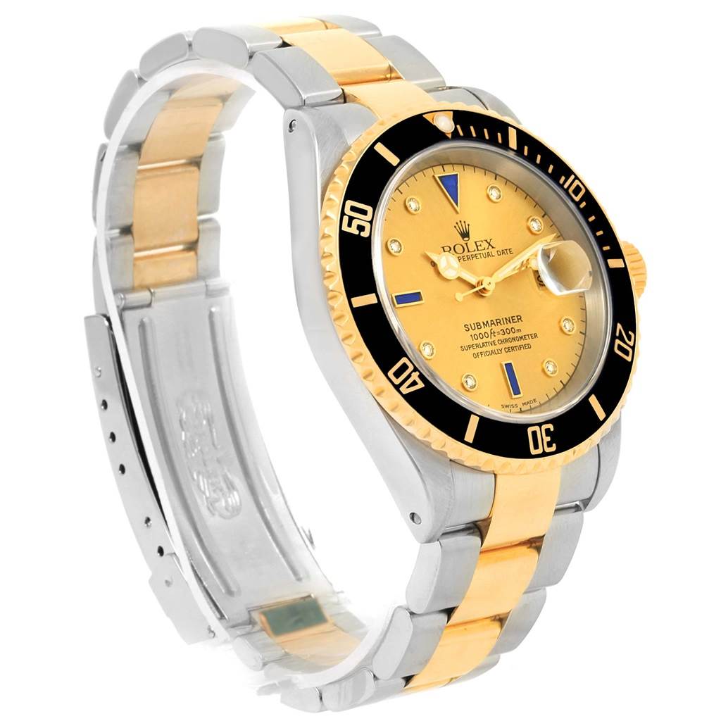 The image shows a side and top angle of a Rolex Submariner 16613 Men's Steel and Gold (two tone) Champagne Dial 16613 Men's Steel and Gold (two tone) Champagne Dial watch, highlighting the face, bezel, and metal band.