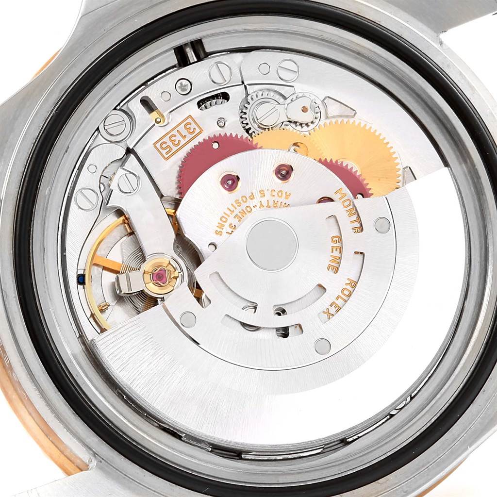 Close-up view of the movement and internal mechanism of a Rolex Submariner 16613 Men's Steel and Gold (two tone) Champagne Dial 16613 Men's Steel and Gold (two tone) Champagne Dial watch.