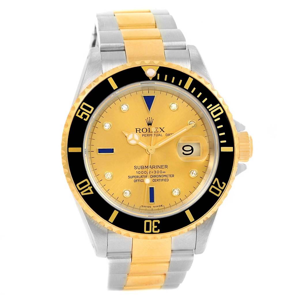 The Rolex Submariner 16613 Men's Steel and Gold (two tone) Champagne Dial 16613 Men's Steel and Gold (two tone) Champagne Dial watch is shown from a front angle, displaying the watch face, bezel, and bracelet.