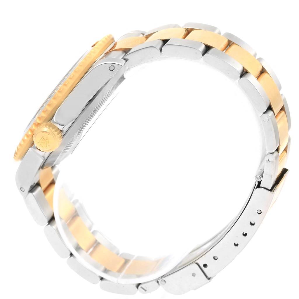 The image shows a side view of the Rolex Submariner 16613 Men's Steel and Gold (two tone) Champagne Dial 16613 Men's Steel and Gold (two tone) Champagne Dial watch, highlighting the crown, case, and two-tone bracelet.