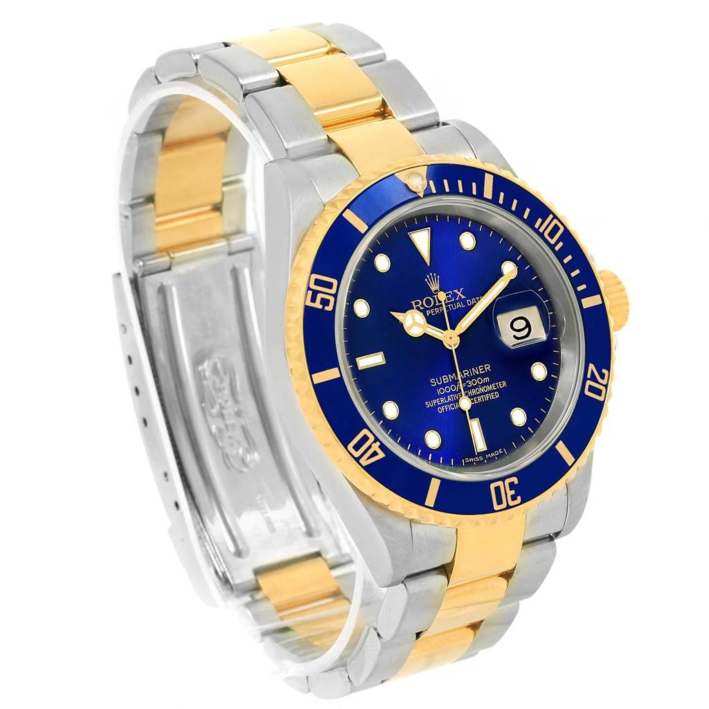This image shows a Rolex Submariner 16613 Men's Steel and Gold (two tone) Blue Dial 16613 Men's Steel and Gold (two tone) Blue Dial watch at an angled front view, highlighting the blue dial, bezel, and two-tone bracelet.