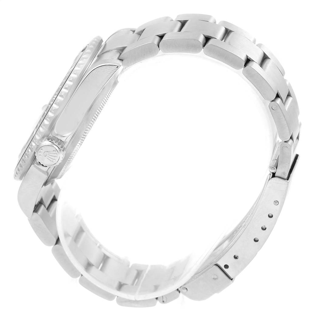 The image shows a side view of a Rolex Submariner 16610 Men's Stainless Steel Black Dial 16610 Men's Stainless Steel Black Dial watch focusing on its bracelet, clasp, and crown.