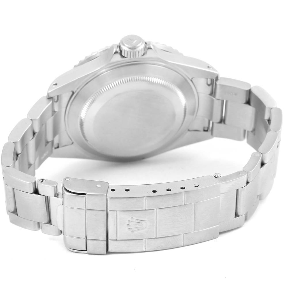 This is a rear view of a Rolex Submariner 16610 Men's Stainless Steel Black Dial 16610 Men's Stainless Steel Black Dial watch showing its case back, bracelet, and clasp.