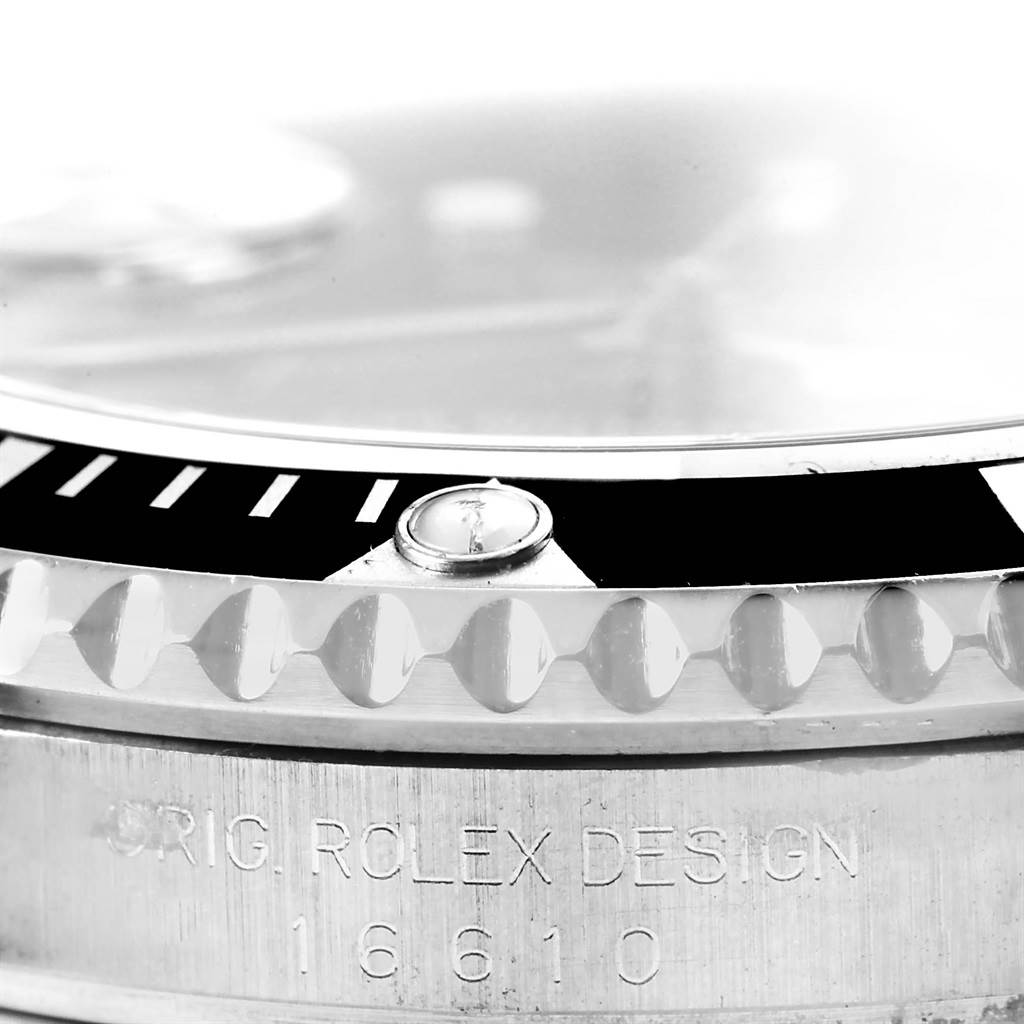 The image shows a close-up side view of a Rolex Submariner 16610 Men's Stainless Steel Black Dial 16610 Men's Stainless Steel Black Dial, displaying the bezel, case, and engraved model number 16610.