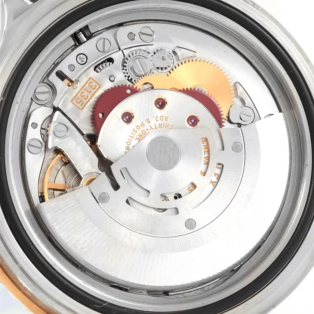 The image shows the intricate internal movement mechanism of a Rolex Submariner 16613 Men's Steel and Gold (two tone) Blue Dial 16613 Men's Steel and Gold (two tone) Blue Dial watch, viewed from the back.