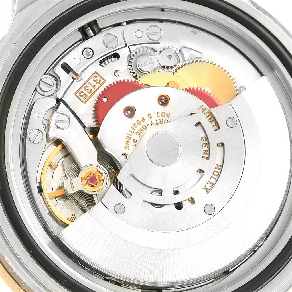 This image shows a close-up view of the movement components inside a Rolex Submariner 16613 Men's Steel and Gold (two tone) Blue Dial 16613 Men's Steel and Gold (two tone) Blue Dial watch.