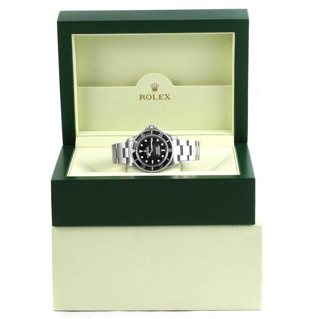 The Rolex Submariner 14060 Men's Stainless Steel Black Dial 14060 Men's Stainless Steel Black Dial watch is displayed front-facing inside its green Rolex box with the bracelet laid flat.