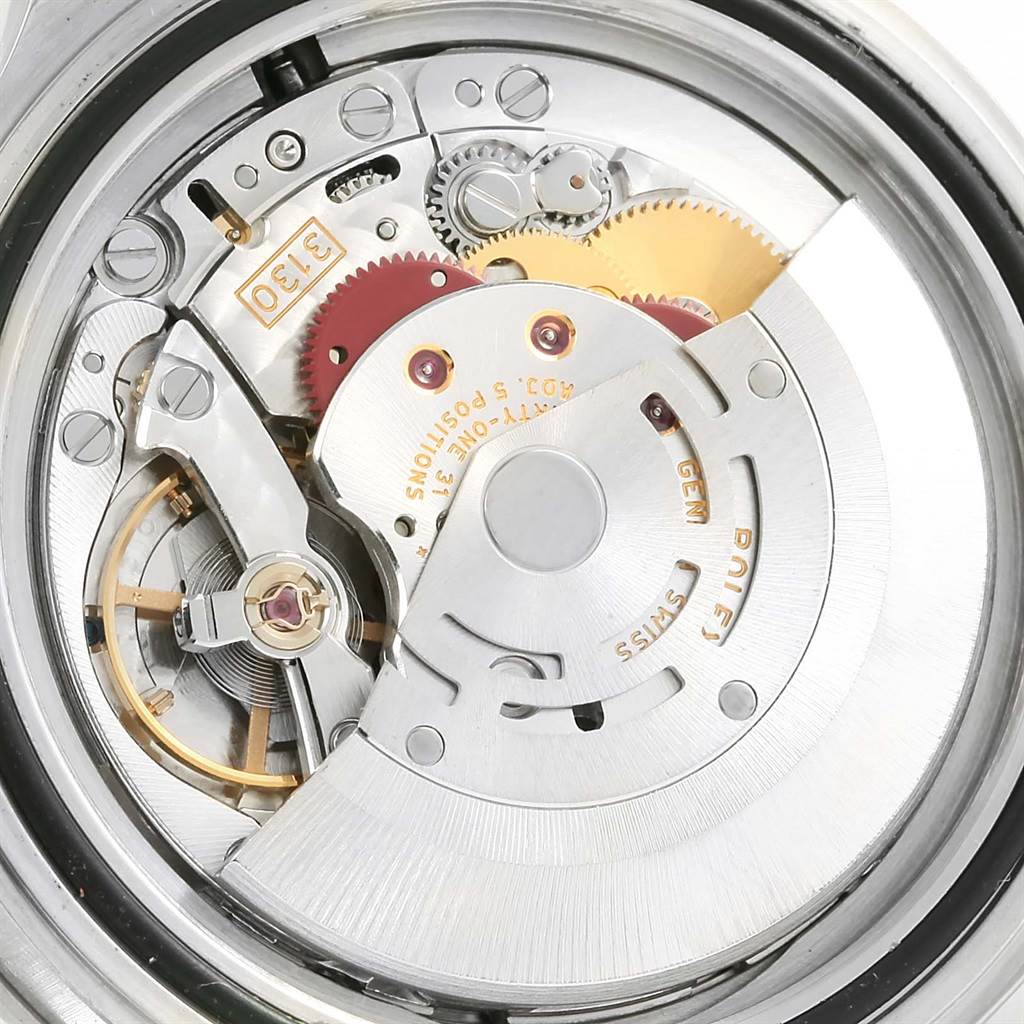 This image shows the internal mechanical movement of the Rolex Submariner 14060 Men's Stainless Steel Black Dial 14060 Men's Stainless Steel Black Dial watch from an open case-back angle.