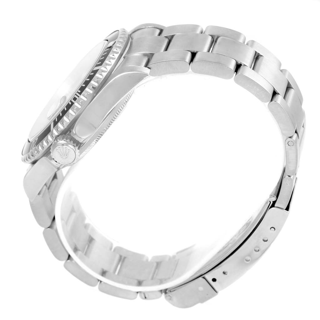 The image shows a side view of the Rolex Submariner 16610 Men's Stainless Steel Black Dial 16610 Men's Stainless Steel Black Dial watch, highlighting the crown, bezel, and bracelet.