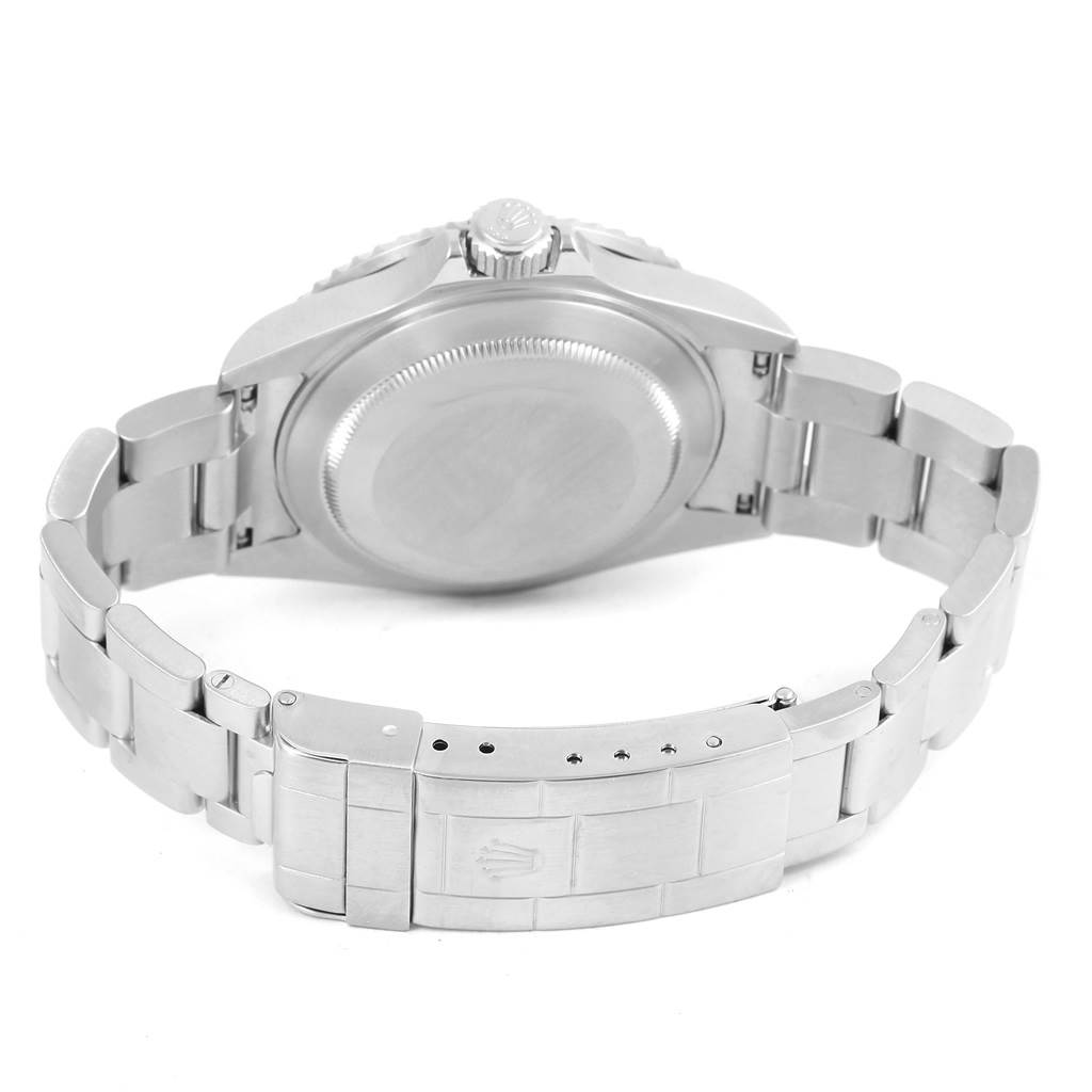 The image shows the back view of a Rolex Submariner 16610 Men's Stainless Steel Black Dial 16610 Men's Stainless Steel Black Dial watch, highlighting its case, crown, and bracelet clasp.