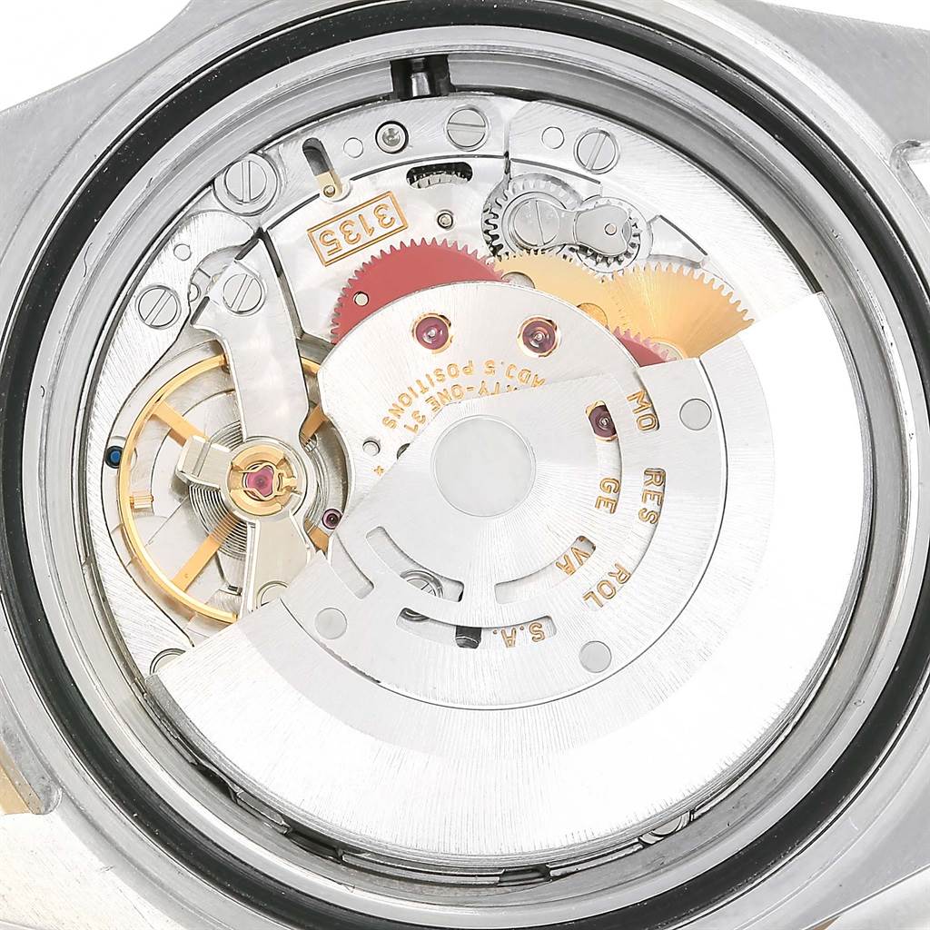 The image shows the internal mechanism and movement of a Rolex Submariner 16613 Men
s Steel and Gold (two tone) Grey Dial 16613 Men
s Steel and Gold (two tone) Grey Dial watch, viewed from the back.