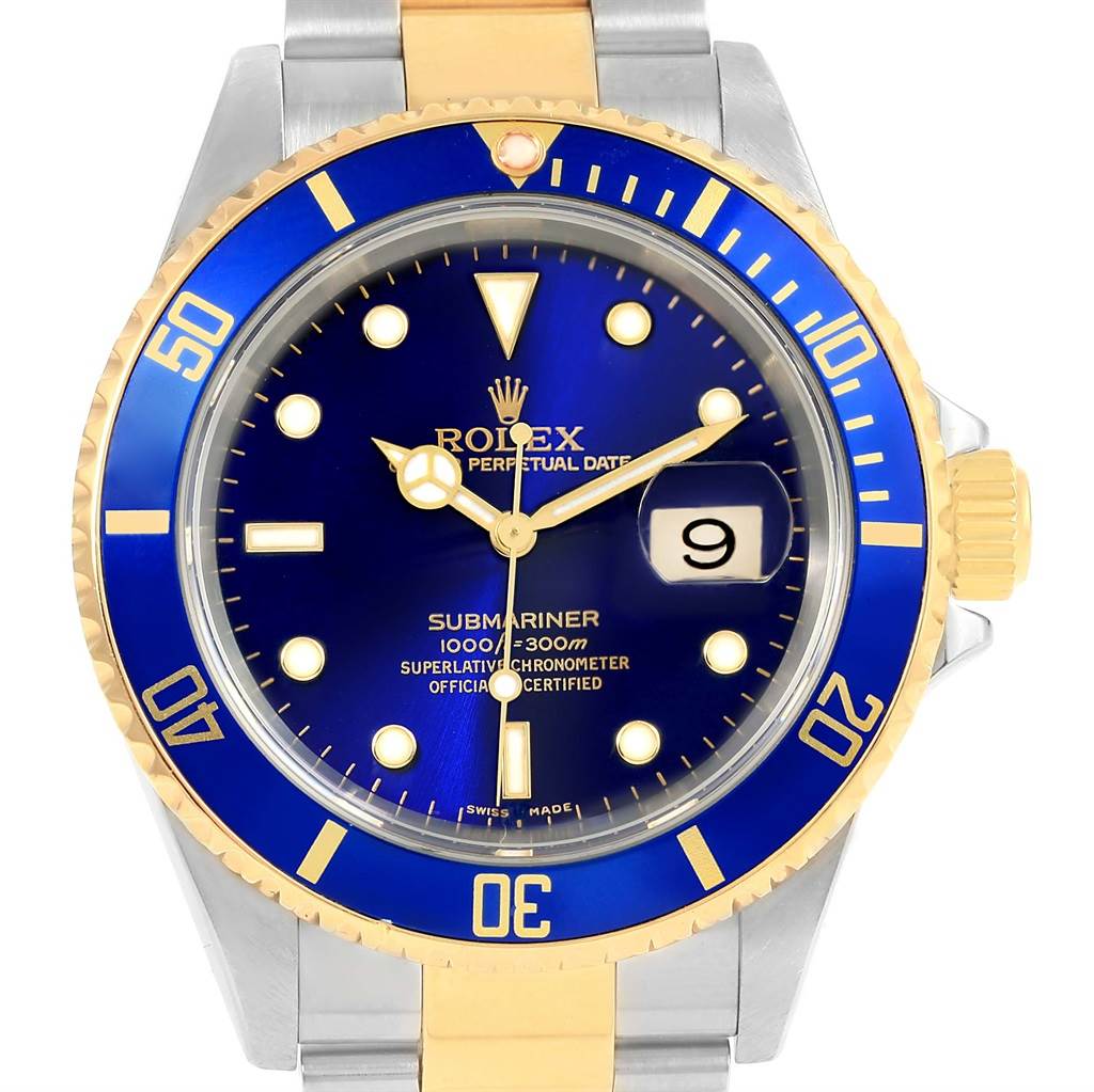 The image shows a front view of a Rolex Submariner 16613 Men's Steel and Gold (two tone) Blue Dial 16613 Men's Steel and Gold (two tone) Blue Dial watch with a blue dial, two-tone stainless steel and gold bracelet, and a date display.