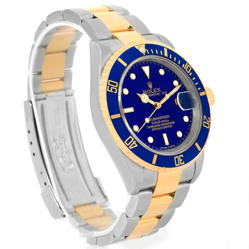 The image shows a Rolex Submariner 16613 Men's Steel and Gold (two tone) Blue Dial 16613 Men's Steel and Gold (two tone) Blue Dial watch from an angled side view, featuring its blue dial, bezel, and two-tone bracelet.