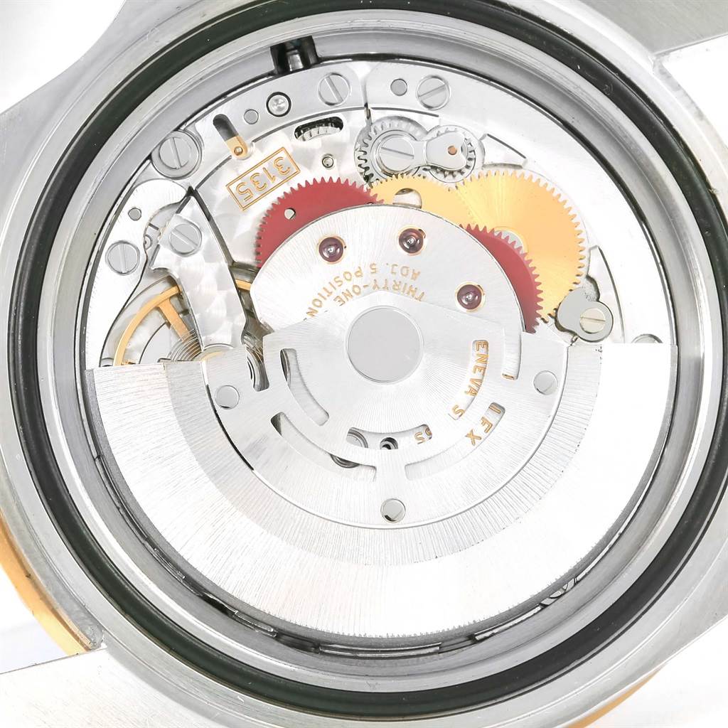This image shows the movement of a Rolex Submariner 16613 Men's Steel and Gold (two tone) Blue Dial 16613 Men's Steel and Gold (two tone) Blue Dial watch from a rear view angle, exposing its intricate internal mechanisms.