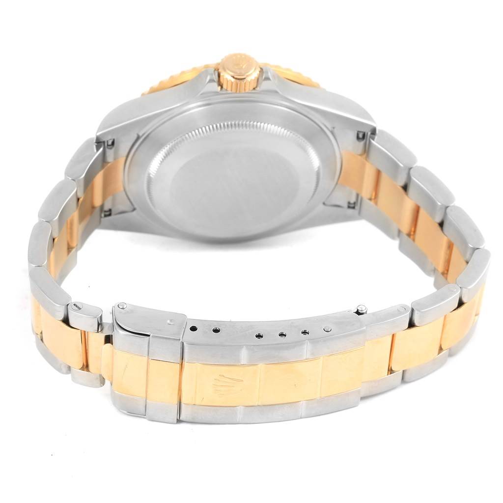 The image shows the backside and bracelet clasp of a Rolex Submariner 16613 Men's Steel and Gold (two tone) Blue Dial 16613 Men's Steel and Gold (two tone) Blue Dial watch, displaying both stainless steel and gold elements.