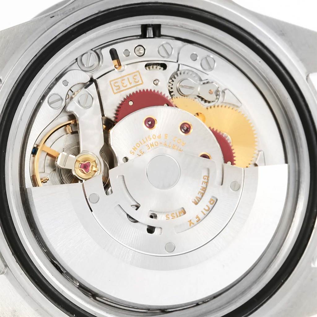 This image shows the back view of the Rolex Submariner 16610 Men's Stainless Steel Black Dial 16610 Men's Stainless Steel Black Dial, displaying its intricate movement and internal components.