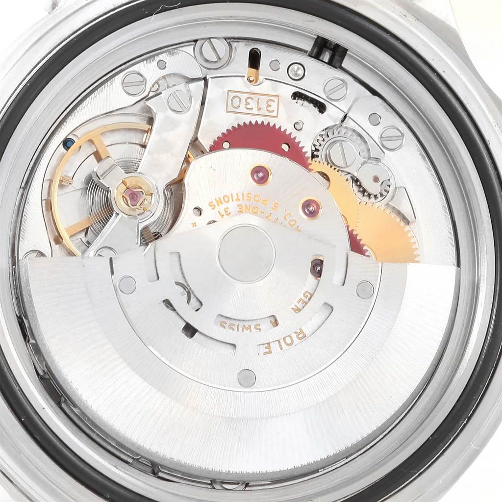 This image shows the internal movement mechanism of a Rolex Submariner 14060 Men's Stainless Steel Black Dial 14060 Men's Stainless Steel Black Dial watch from a rear angle.