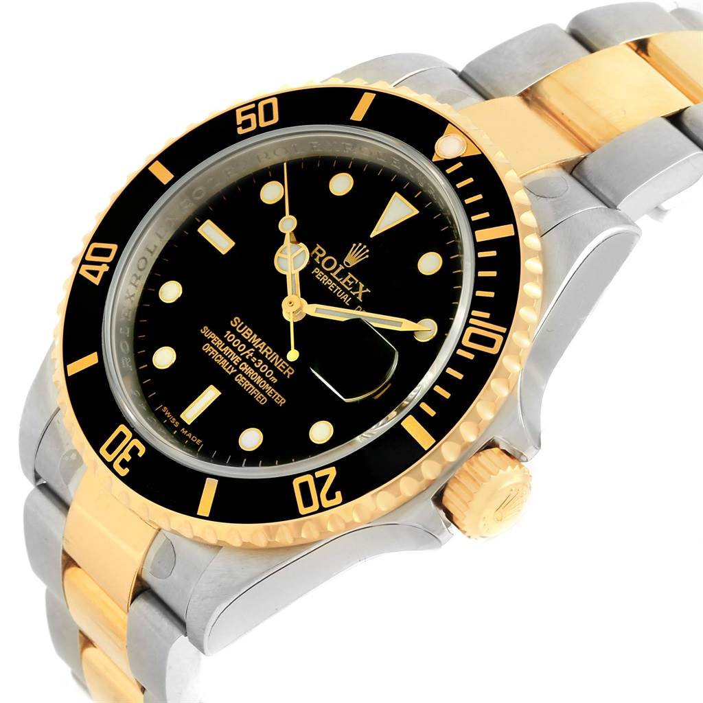 This image shows a Rolex Submariner 16613 Men
s Steel and Gold (two tone) Black Dial 16613 Men
s Steel and Gold (two tone) Black Dial watch at a three-quarter angle, highlighting its black dial, gold bezel, and two-tone bracelet.