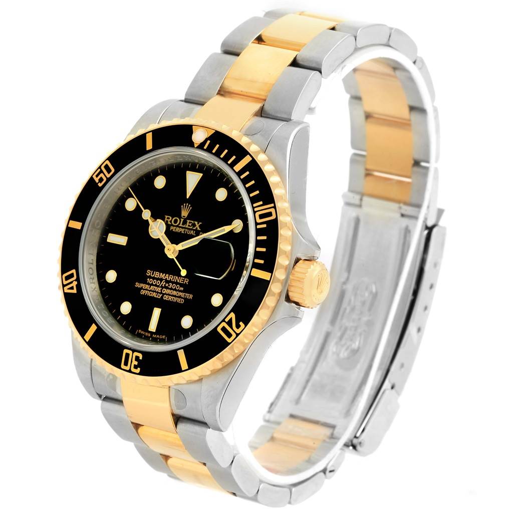 The Rolex Submariner 16613 Men
s Steel and Gold (two tone) Black Dial 16613 Men
s Steel and Gold (two tone) Black Dial watch is shown at an angle highlighting the face, bezel, crown, and bracelet.